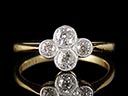 A beautiful vintage 18ct yellow Gold & Platinum Art Deco Diamond quaterfoil ring, comprising of two beautiful .17ct Old Brilliant Cut Diamonds and a further two .08ct Old Brilliant Cut Diamonds